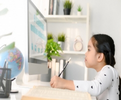 happy-beautiful-little-girl-student-using-computer-study-through-online-e-learning_36051-412